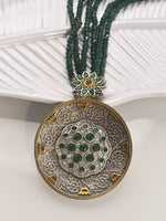 Load image into Gallery viewer, necklace with a large circular pendant featuring green gemstones