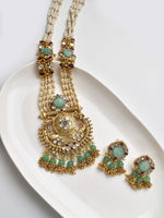 Load image into Gallery viewer, Ornate gold necklace with green gemstones