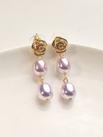 Load image into Gallery viewer, Pair of earrings with rose-shaped tops