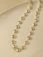 Load image into Gallery viewer, gold-tone beaded necklace with faceted, pearl-like beads