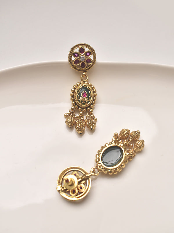Golden earrings.with gemstones 
