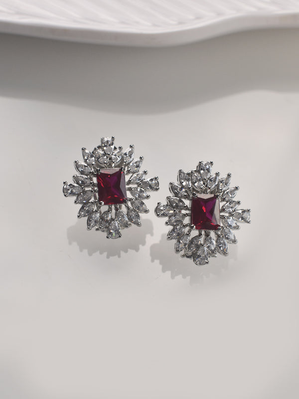 Pair of silver earrings with red gemstones 
