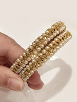 Load image into Gallery viewer, The Royal Moti Criss-Cross Bangles | Classic Golden Thread Beads Bangles
