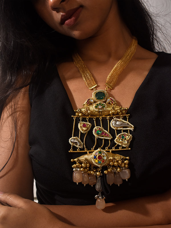  ornate golden necklace with gemstones 