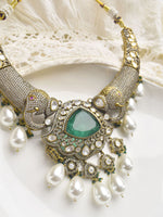 Load image into Gallery viewer, Ornate Necklace with Big Green Gemstone and Pearls Drops | Stylish Kundan Necklace set
