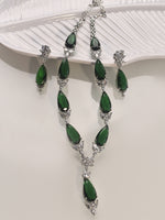 Load image into Gallery viewer, Green gemstone necklace and earrings on a white background
