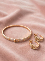 Load image into Gallery viewer, A gold-tone bangle bracelet and matching hoop earrings
