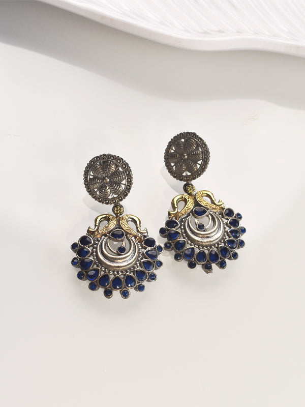 Pair of ornate earrings with blue stones 
