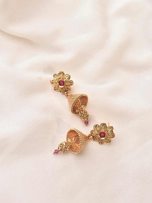 Golden earrings with red gemstones