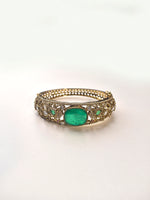 Load image into Gallery viewer, Gold bracelet with a green gemstone on a white background
