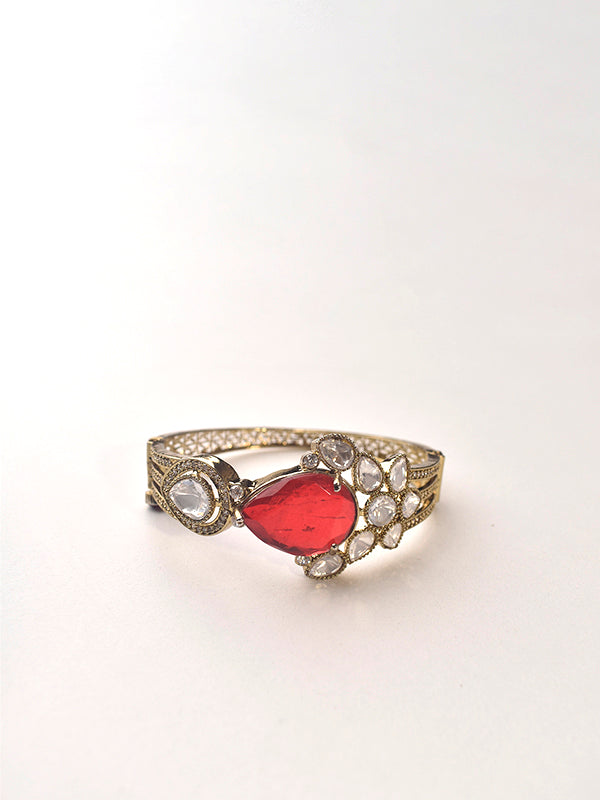 Decorative bracelet with a red gemstone 