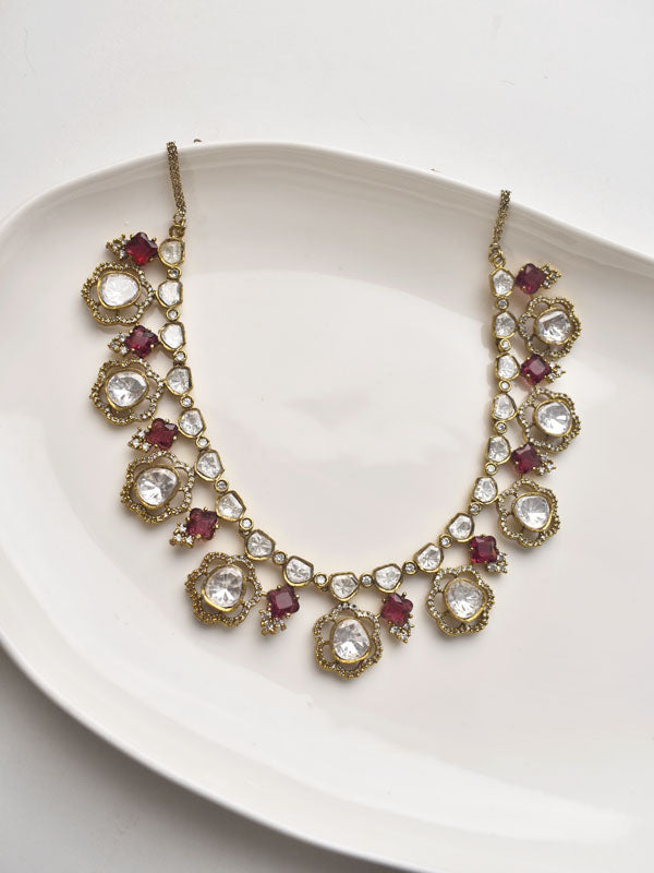 Decorative necklace with red and clear gemstones 
