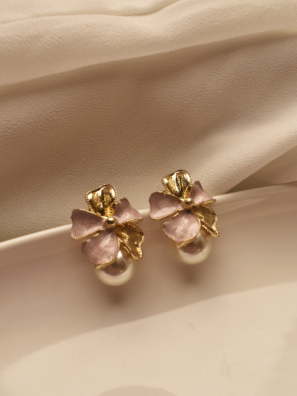 Earrings with pink bows and gold accents 