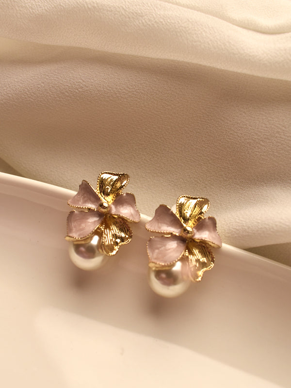 Earrings with pink bows and gold accents 