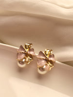 Load image into Gallery viewer, Earrings with pink bows and gold accents 
