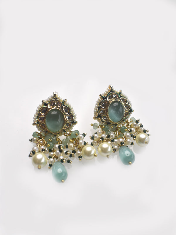 Earrings with green stones and pearl like beads 