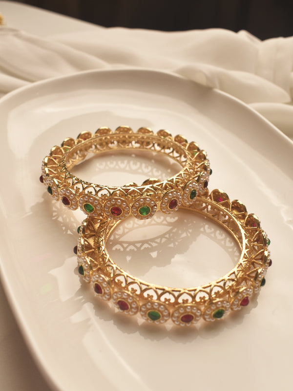 Gold bangles with gemstones 