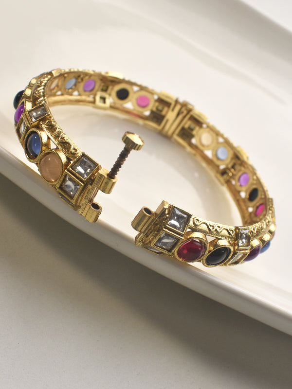Gold bracelet with colorful gemstones o