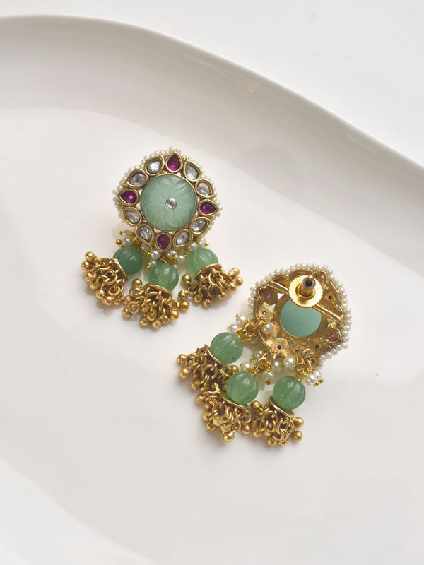 Gold earrings with green gemstones 