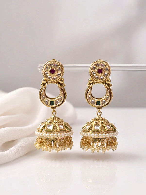 Gold earrings with red and green gemstones 