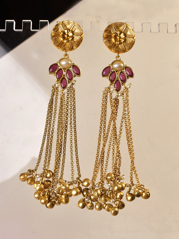 Gold earrings with red gemstones and dangling chains 