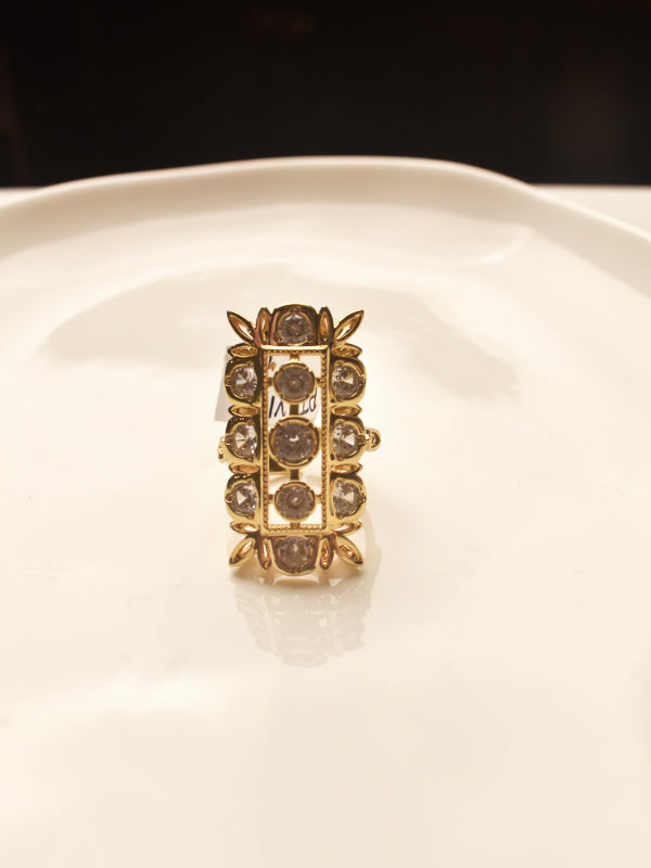 Gold ring with embedded stones 