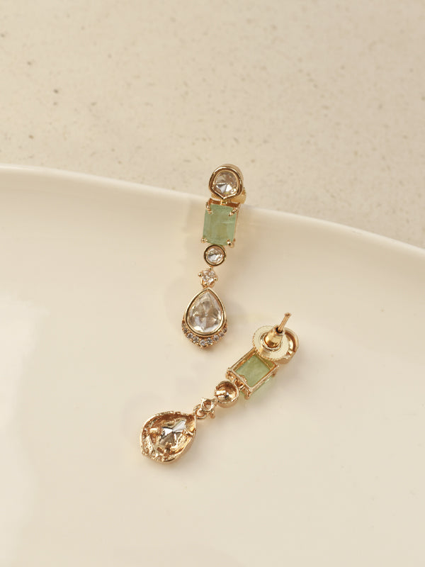 Golden earrings with green gemstones 