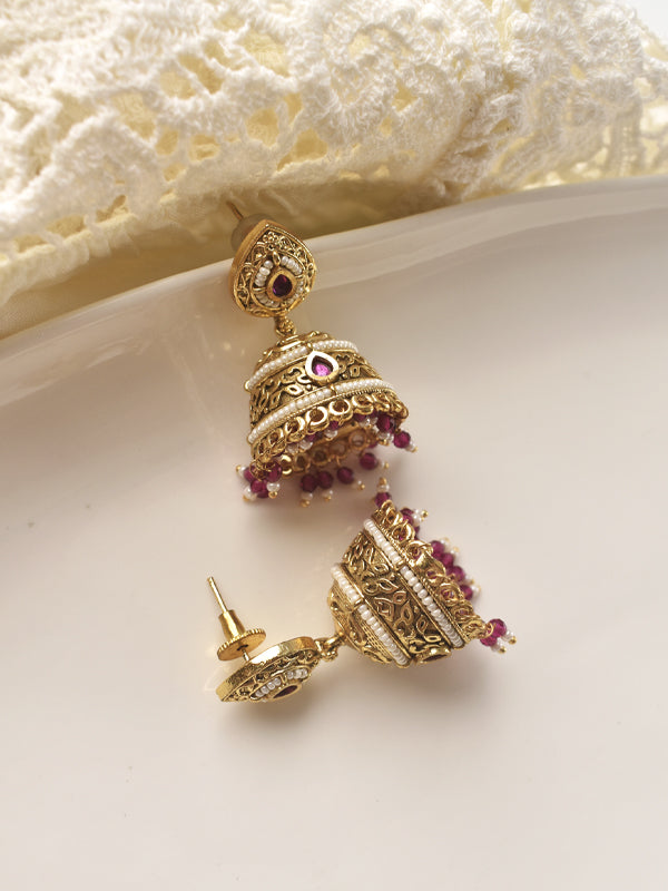Gold earrings with red gemstones 