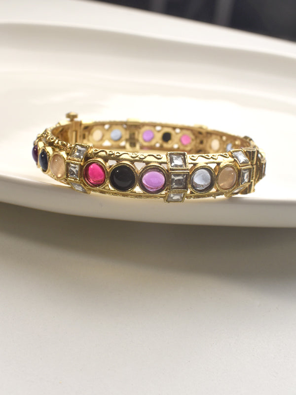 Golden bracelet with colorful gemstones 