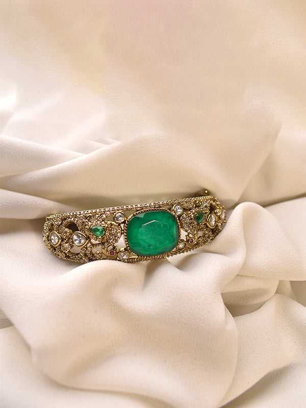 Golden Bracelet with a Green Gemstone 