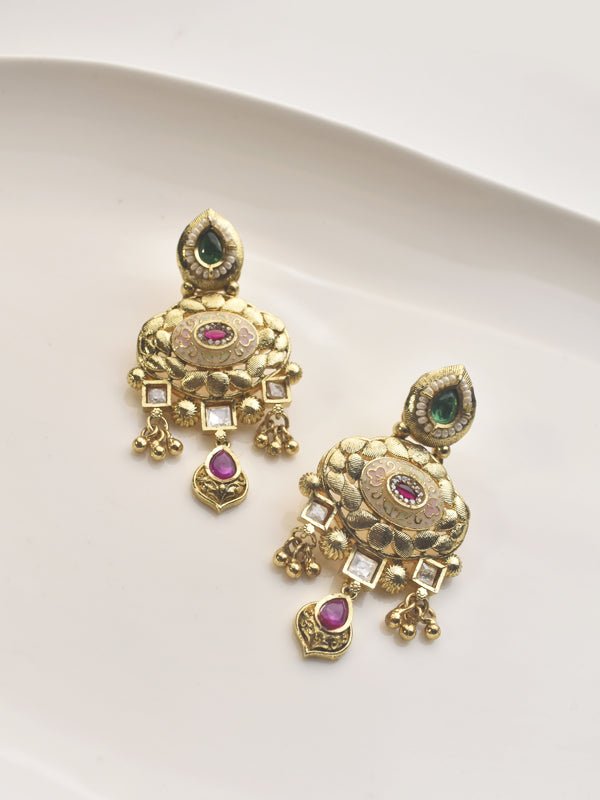 Golden earrings with intricate designs | earrings with red and green stones