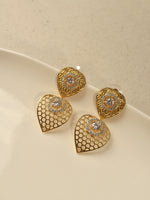 Load image into Gallery viewer, Golden Heart-Shaped earrings with intricate designs 
