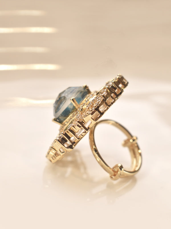 Golden Ring with a Blue Gemstone 