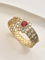 Load image into Gallery viewer, Golden bracelet with a red gemstone 
