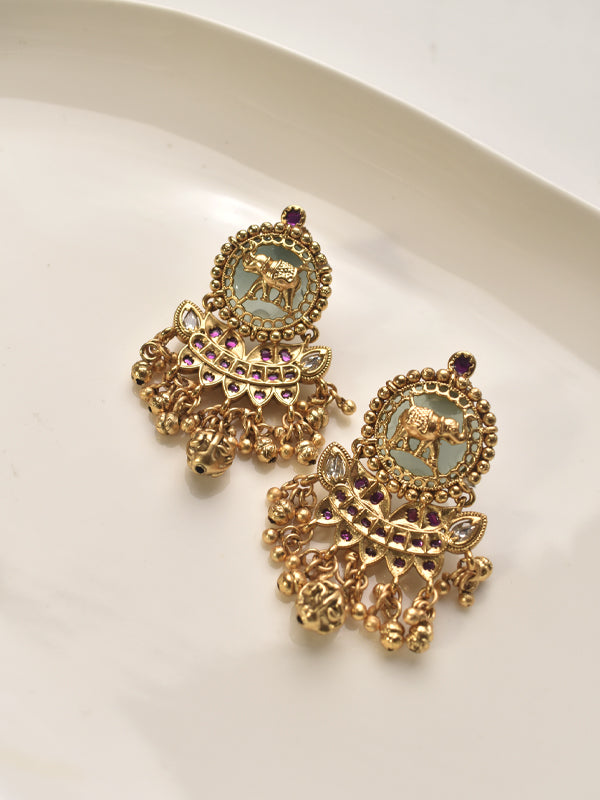Golden earrings with intricate designs 