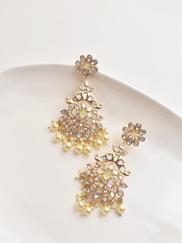 Golden earrings with floral designs 