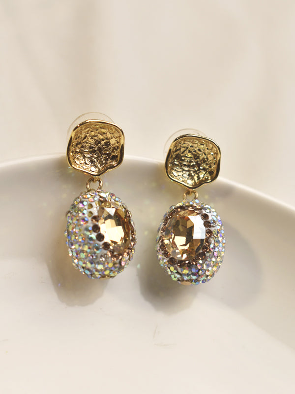 Golden earrings with gemstone-like tops 