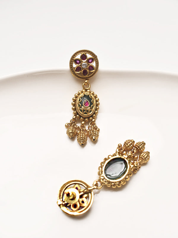 Golden earrings.with gemstones 