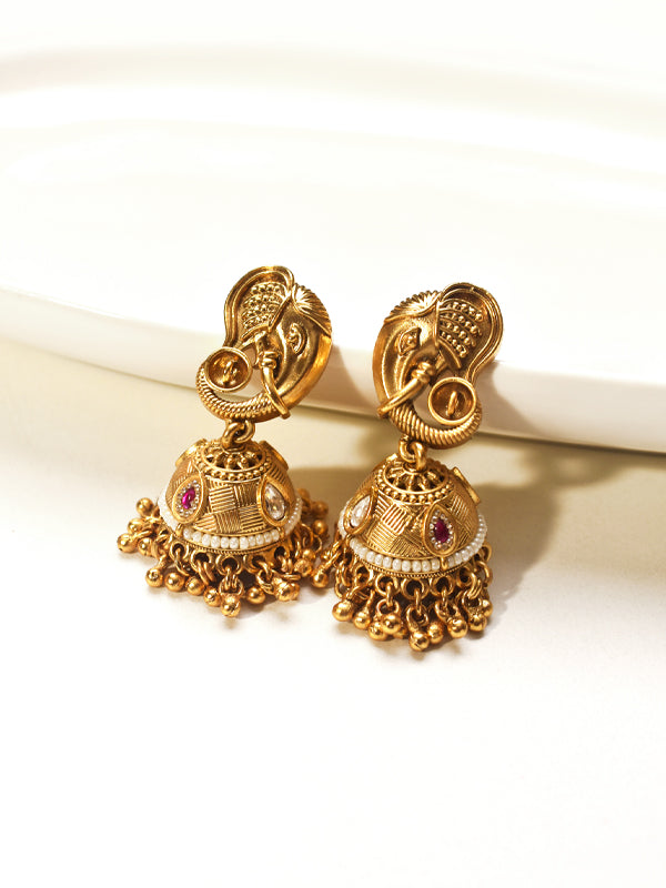 Golden earrings with intricate designs 