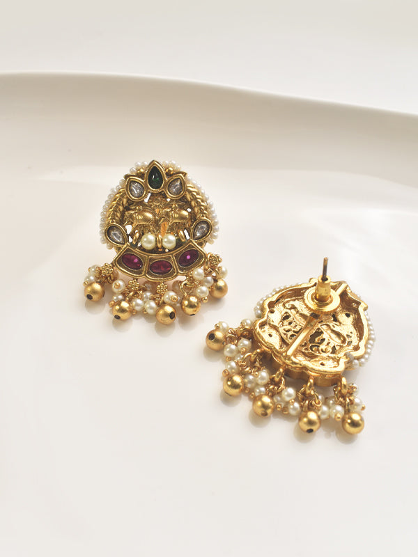 Golden earrings with intricate designs and pearl-like beads 