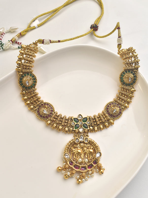 Golden necklace with intricate designs 