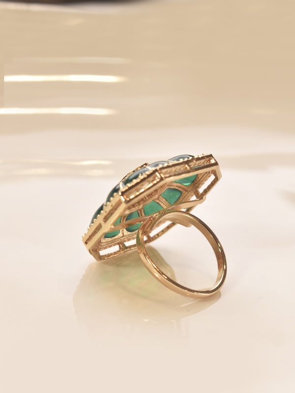 Golden ring with green gemstone 