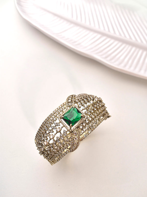 Golden Bracelet with a Green Gemstone 