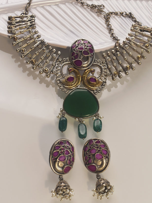 Decorative necklace with peacock designs and green and purple stones 