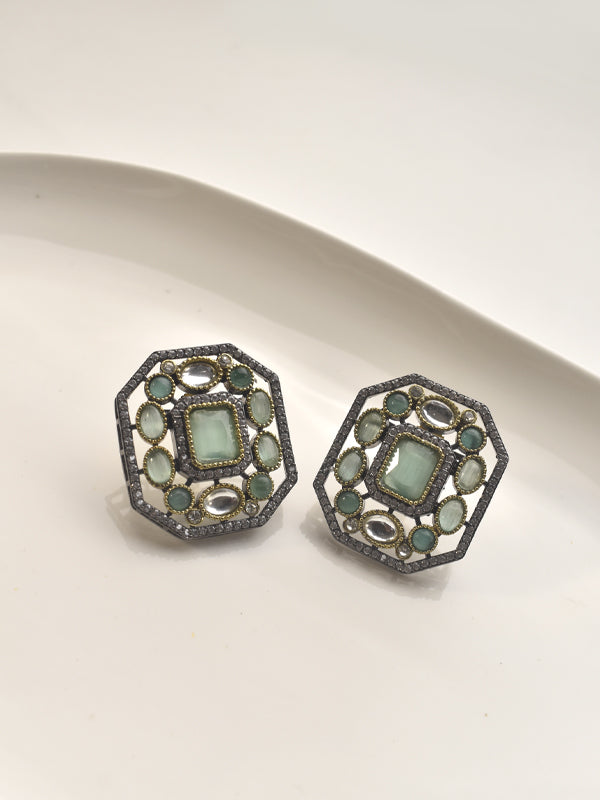 Hexagonal earrings with green gemstones 