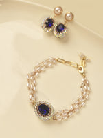 Load image into Gallery viewer, Jewelry set with bracelet and earrings featuring blue gemstones 
