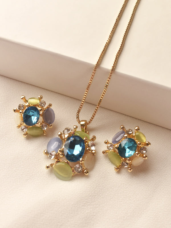 Jewelry set with necklace and earrings featuring blue and green gemstones 