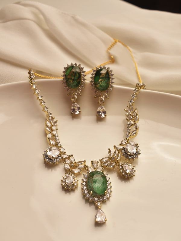 Jewelry set with necklace and earrings featuring green gemstone