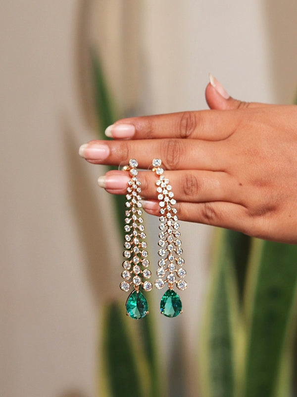 pair of earrings with green drops 