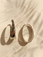 Load image into Gallery viewer, Minimalist Tapered Silver Oval Hoops
